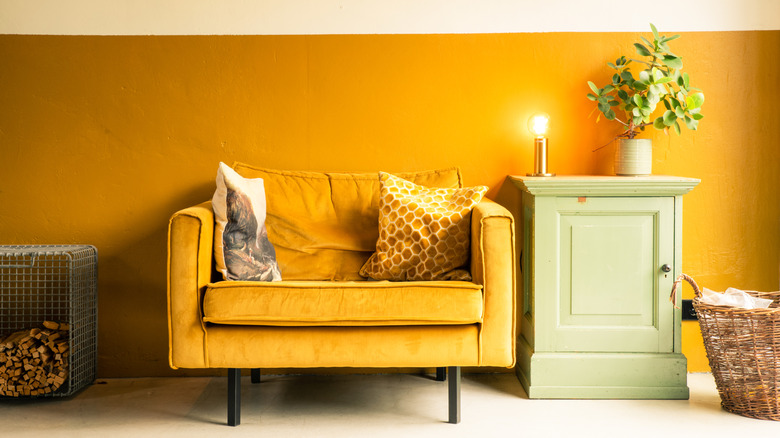 Dark yellow mid century modern living space.