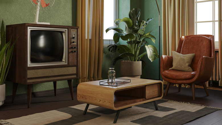 A mid century living room with earthy colors.