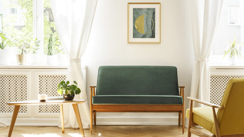 A mid century interior with simple curtains on the windows