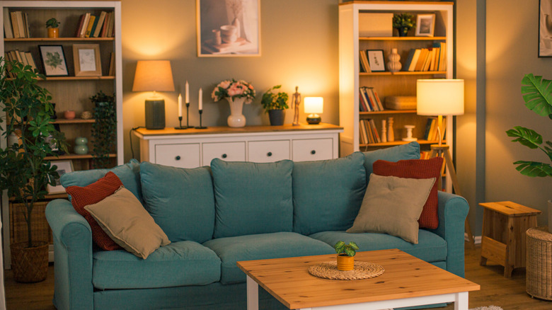 A cozy living room with a blue couch.