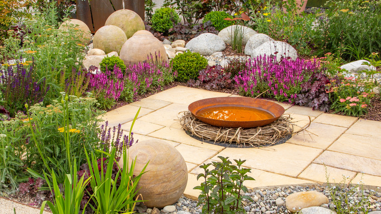 ground birdbath in garden