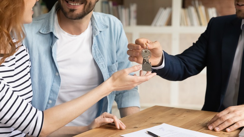 couple receiving new house keys