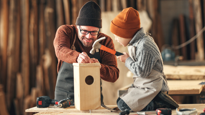 child using hammer with safety grip