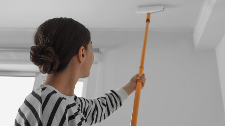 woman painting a ceiling