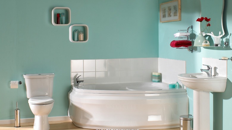 Turquoise bathroom standard toilet
