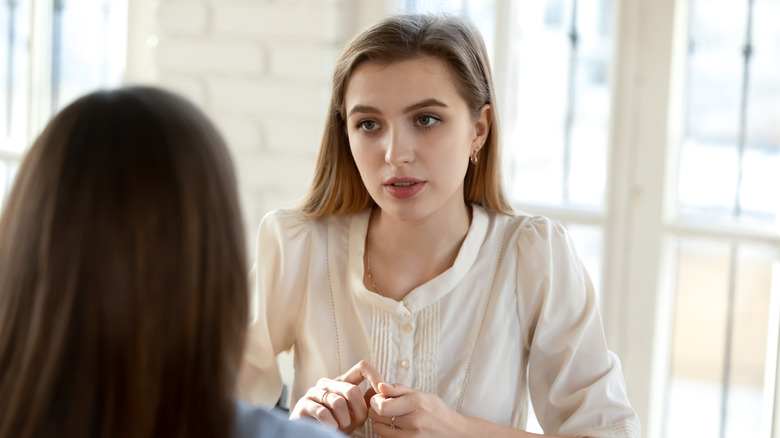 woman being interviewed in office