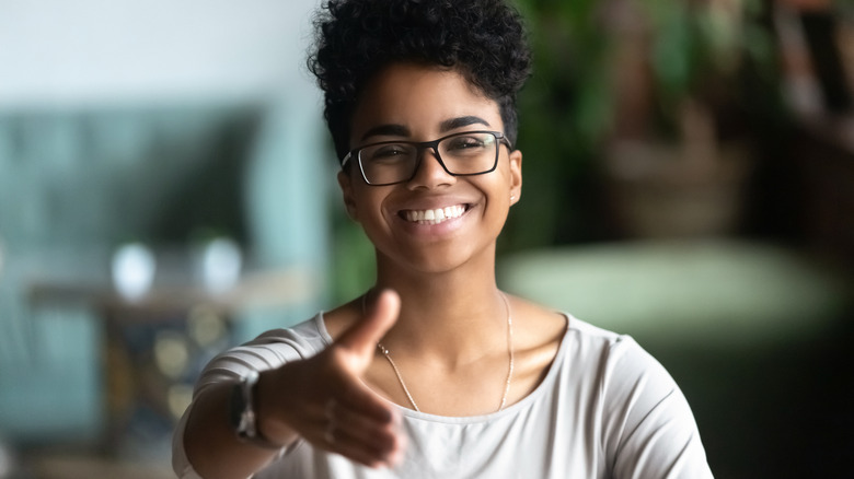 woman holding out hand