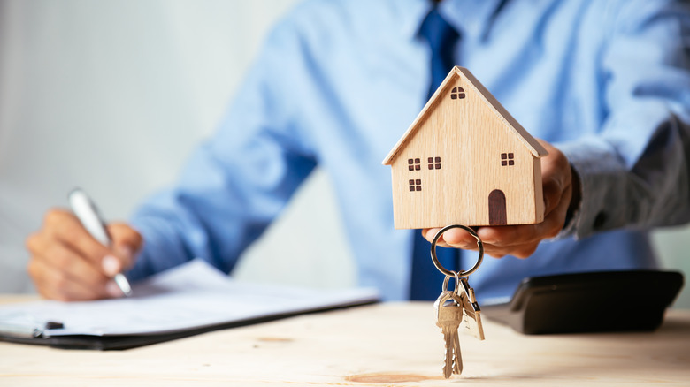 Agent holding house model