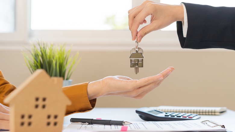 person receiving house key