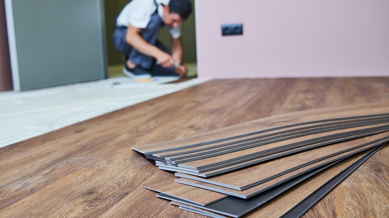 Man removing flooring