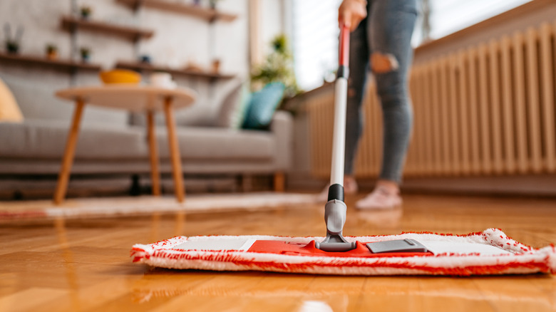 Woman mopping floor