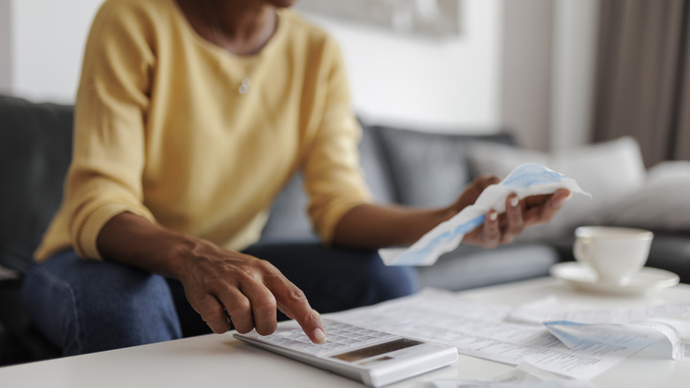 woman calculating budget