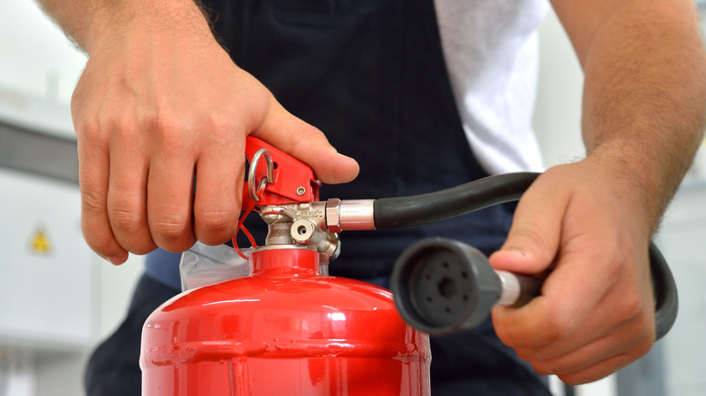 checking fire extinguisher