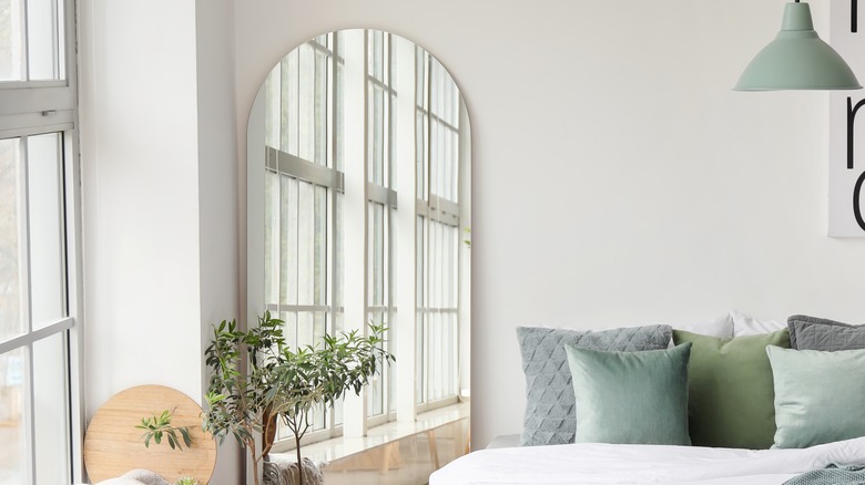 Frameless oblong-shaped floor mirror