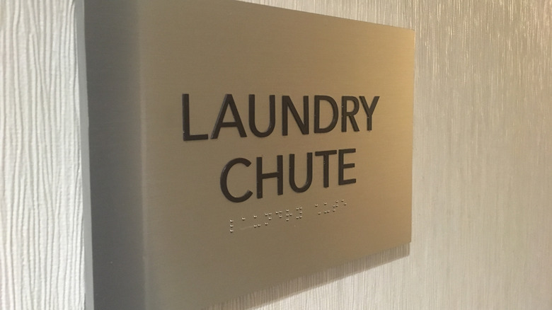 laundry chute sign on wall