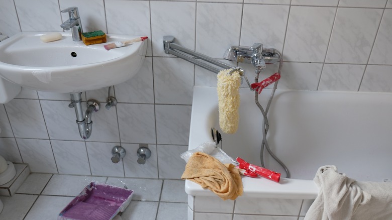 paint supplies on bathtub