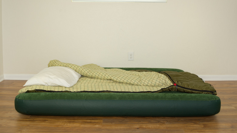 green air mattress with pillow