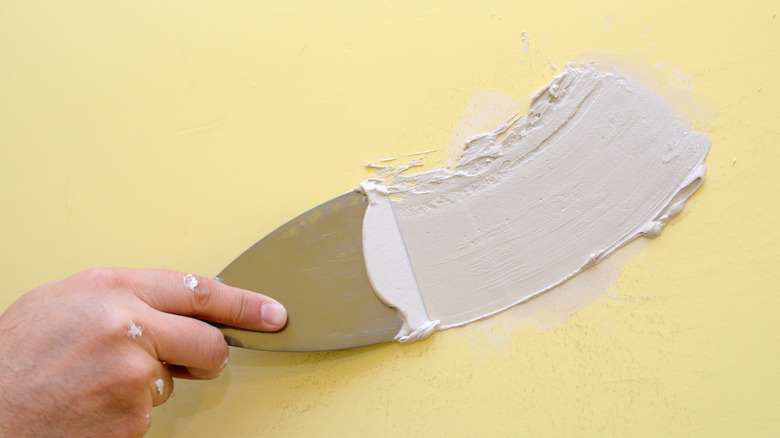 spackle compound on a wall