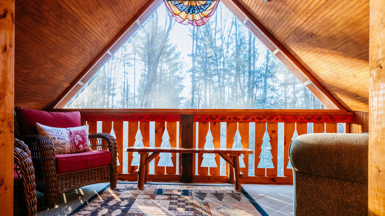 Adirondack interior room looking out over trees