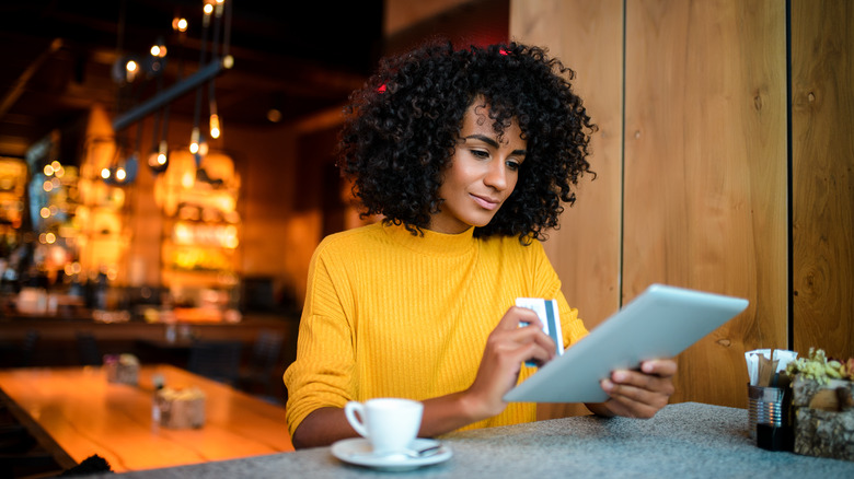 Woman shopping on tablet