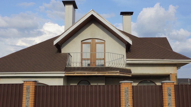 House with metal tile roof
