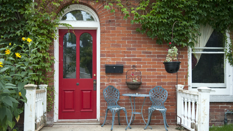 Red front door on patio