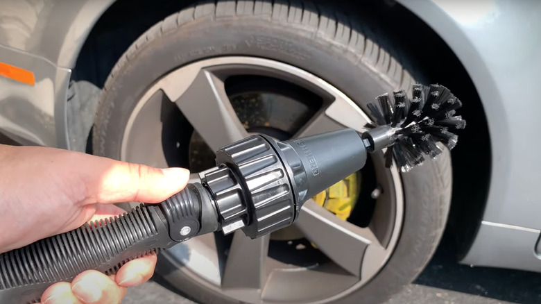 man cleaning motorcycle with Brush Hero