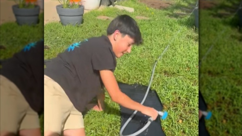 Child using the Scrubbie