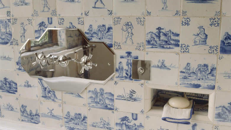 A close up on Delft tiles in a shower.