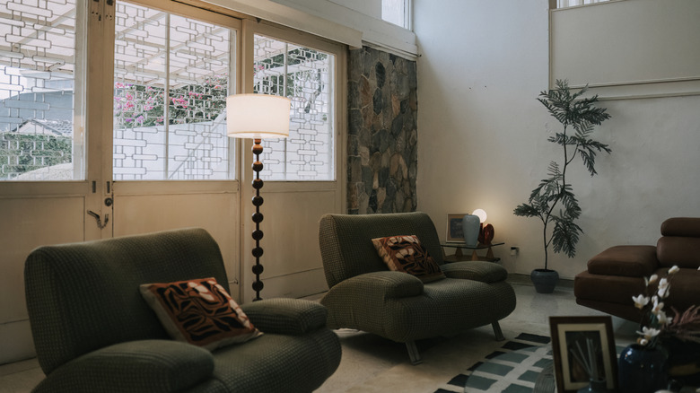 Mid century home with floor and table lamp; accent lighting.