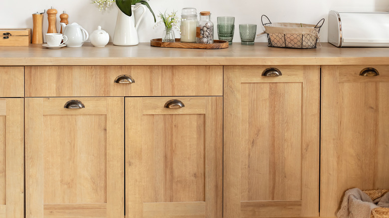 Wooden kitchen cabinets with decor