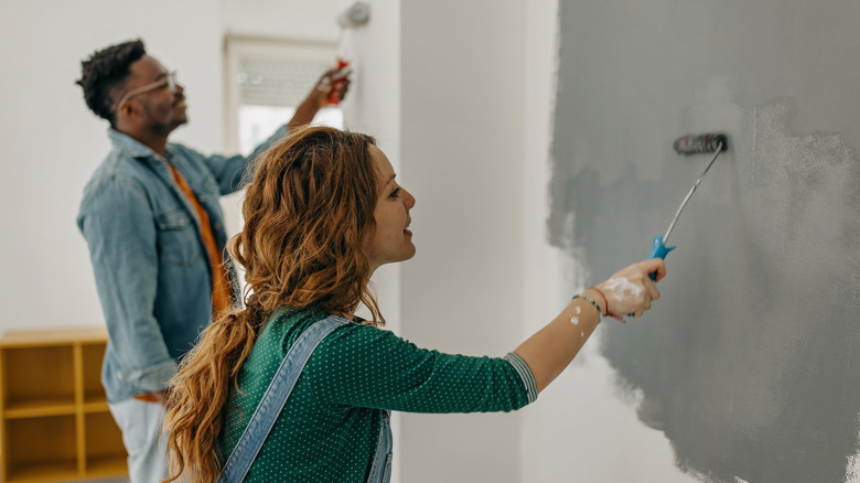 couple painting dark room