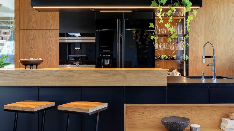 Dual-height kitchen counter with stools