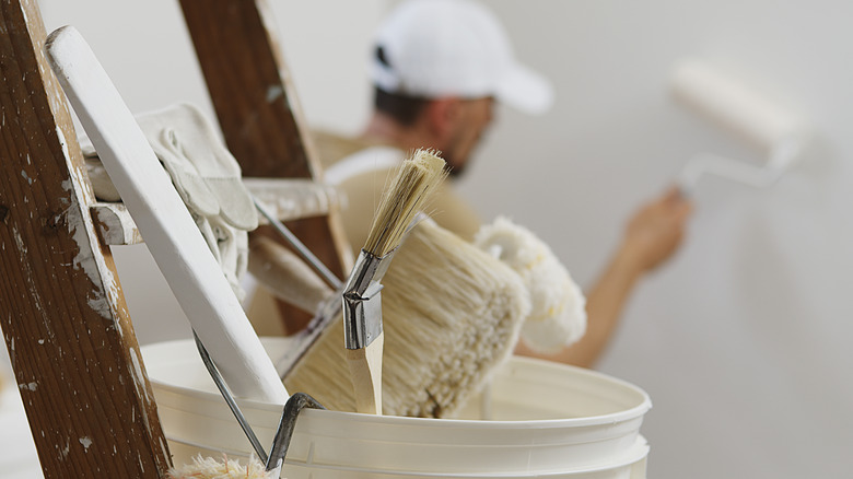 man painting wall