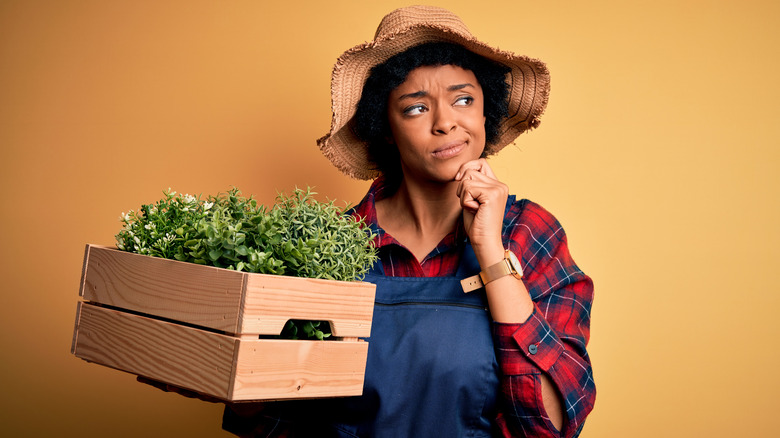 Confused person with vegetables