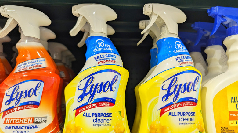 A row of Lysol All-Purpose Cleaner bottles on a store shelf