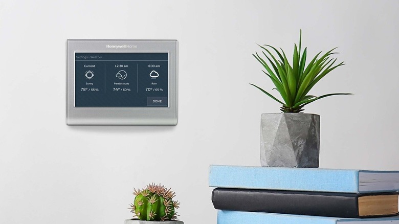 A Honeywell smart thermostat in action on somebody's wall