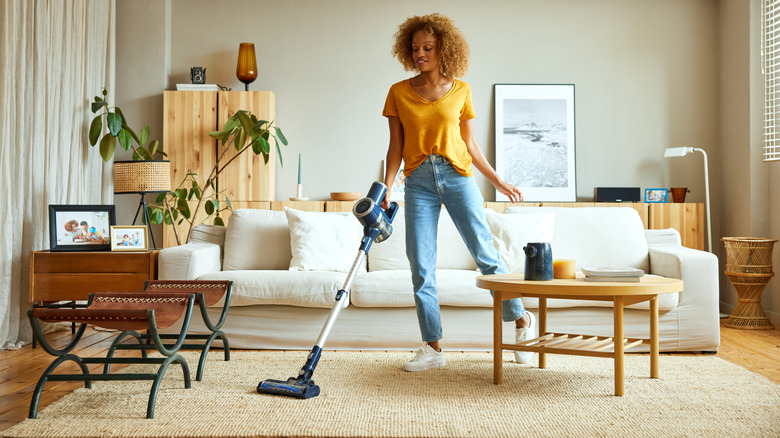 A woman vacuuming