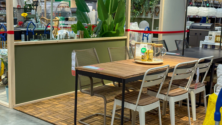 An IKEA patio set featuring an outdoor dining table and chairs set up on a sales floor