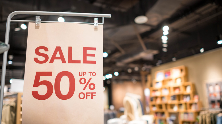 A 50% off sign placed in a store