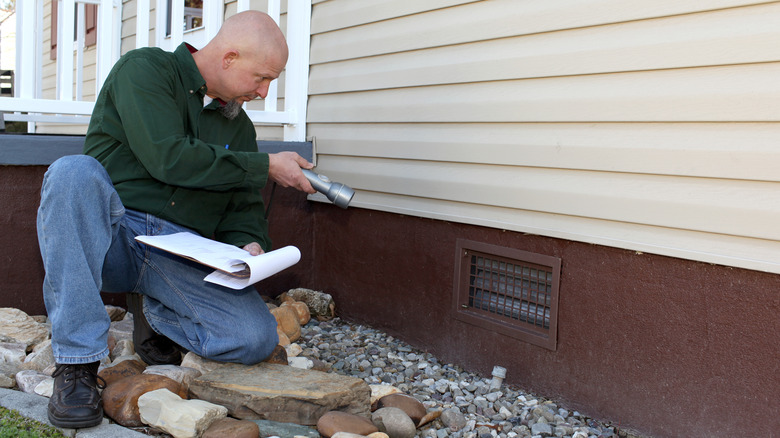 Checking a home's foundation for damage