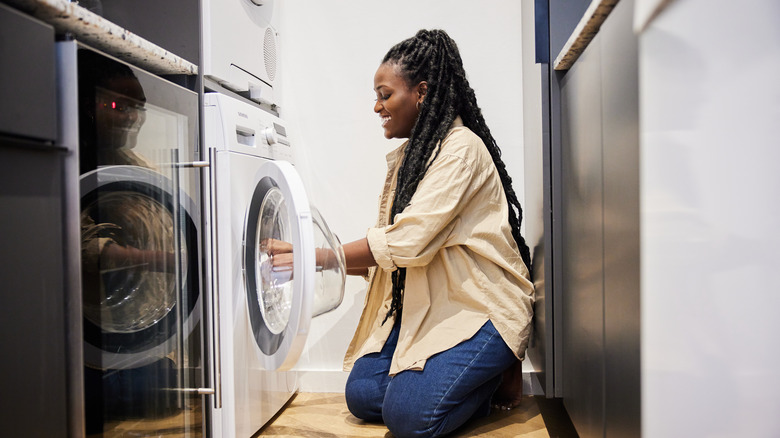 woman using washer and dryer