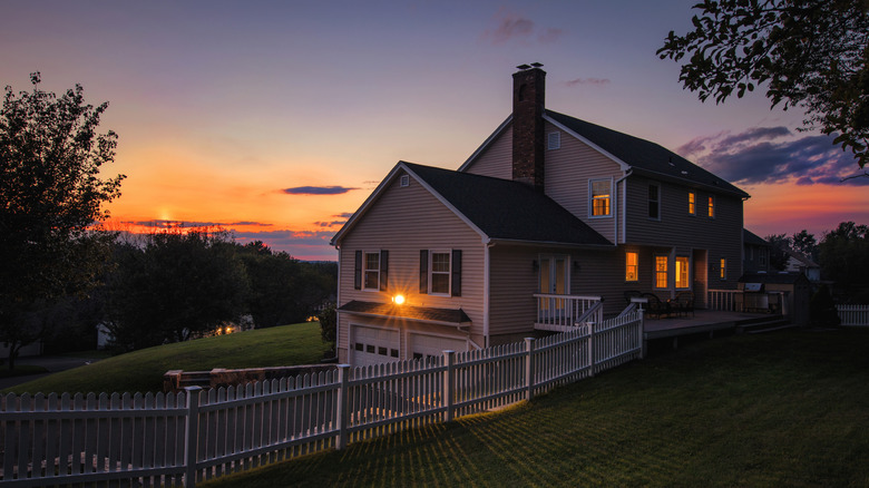Sunset descends over a colonial style house