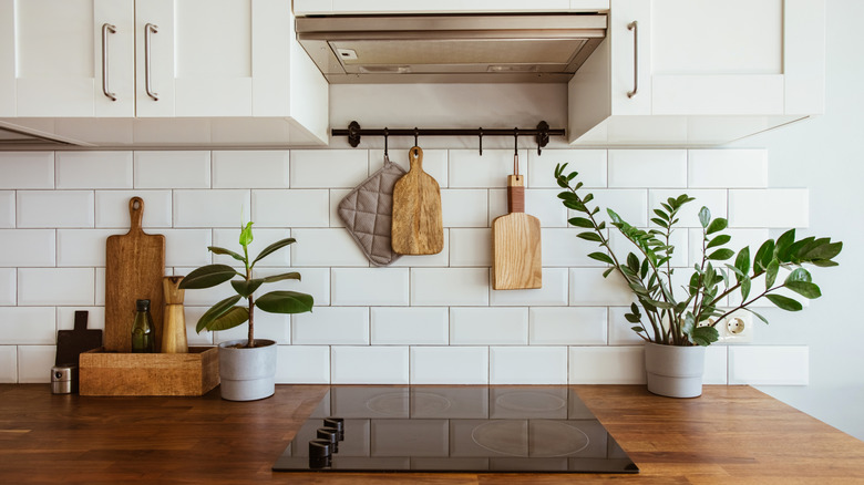 Neutral white kitchen with white tile backsplash