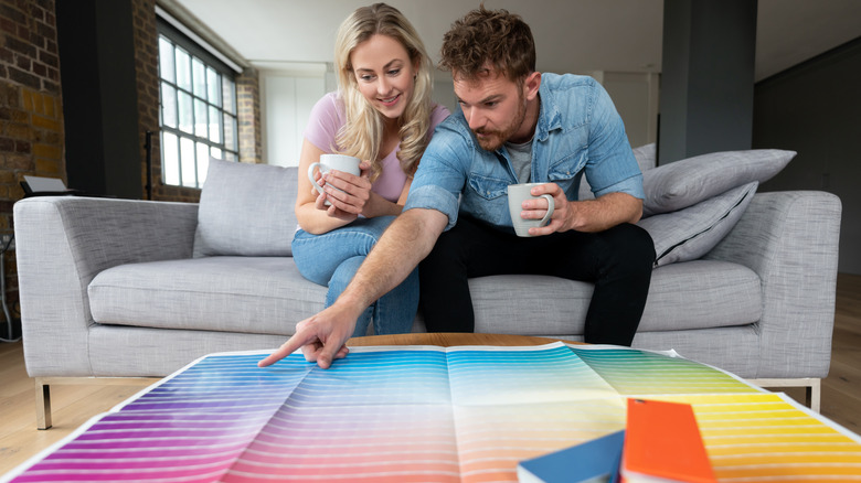 Couple looking at paint samples