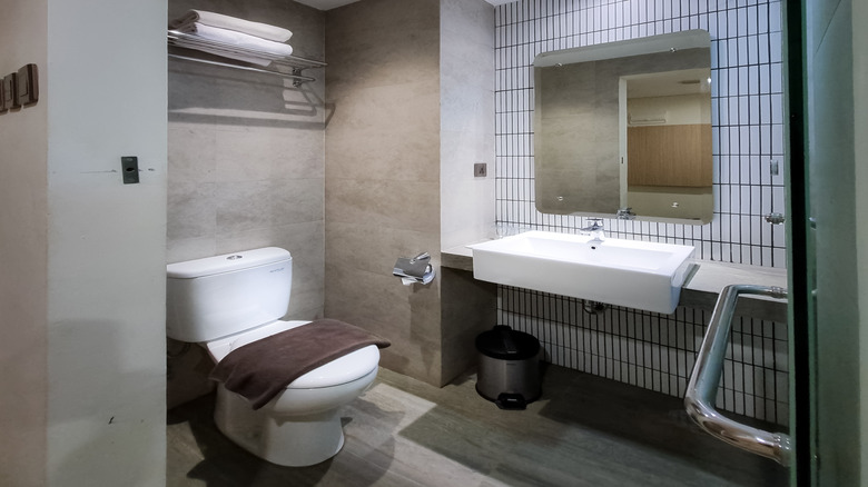 Towel storage near a ceiling vent in a bathroom