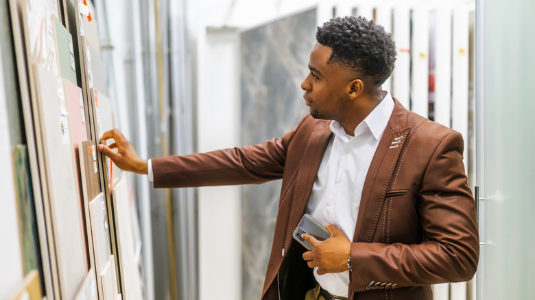 man shopping for home tiles