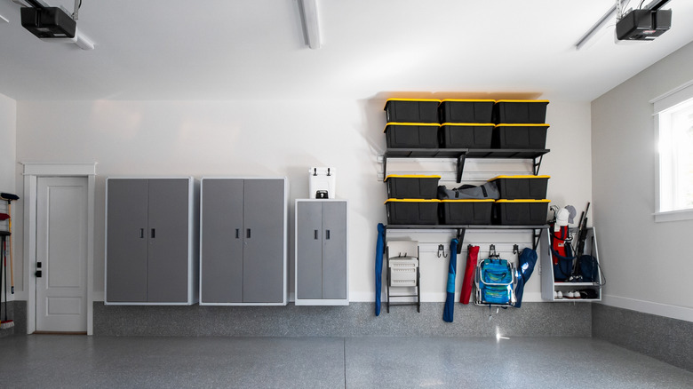 A garage organized with floating shelves