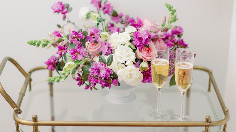 Gold bar cart with flowers