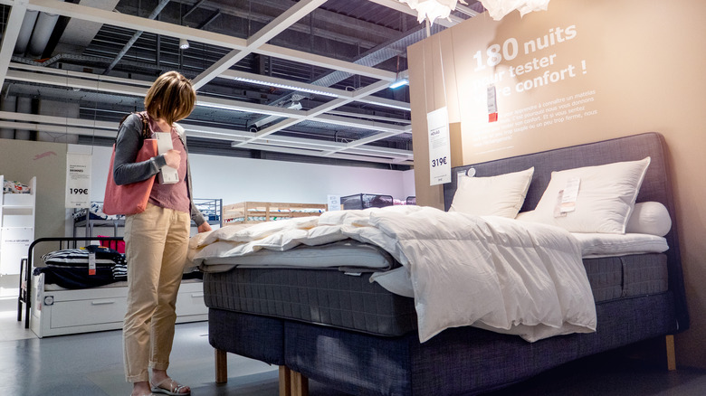 Woman looking at IKEA bed